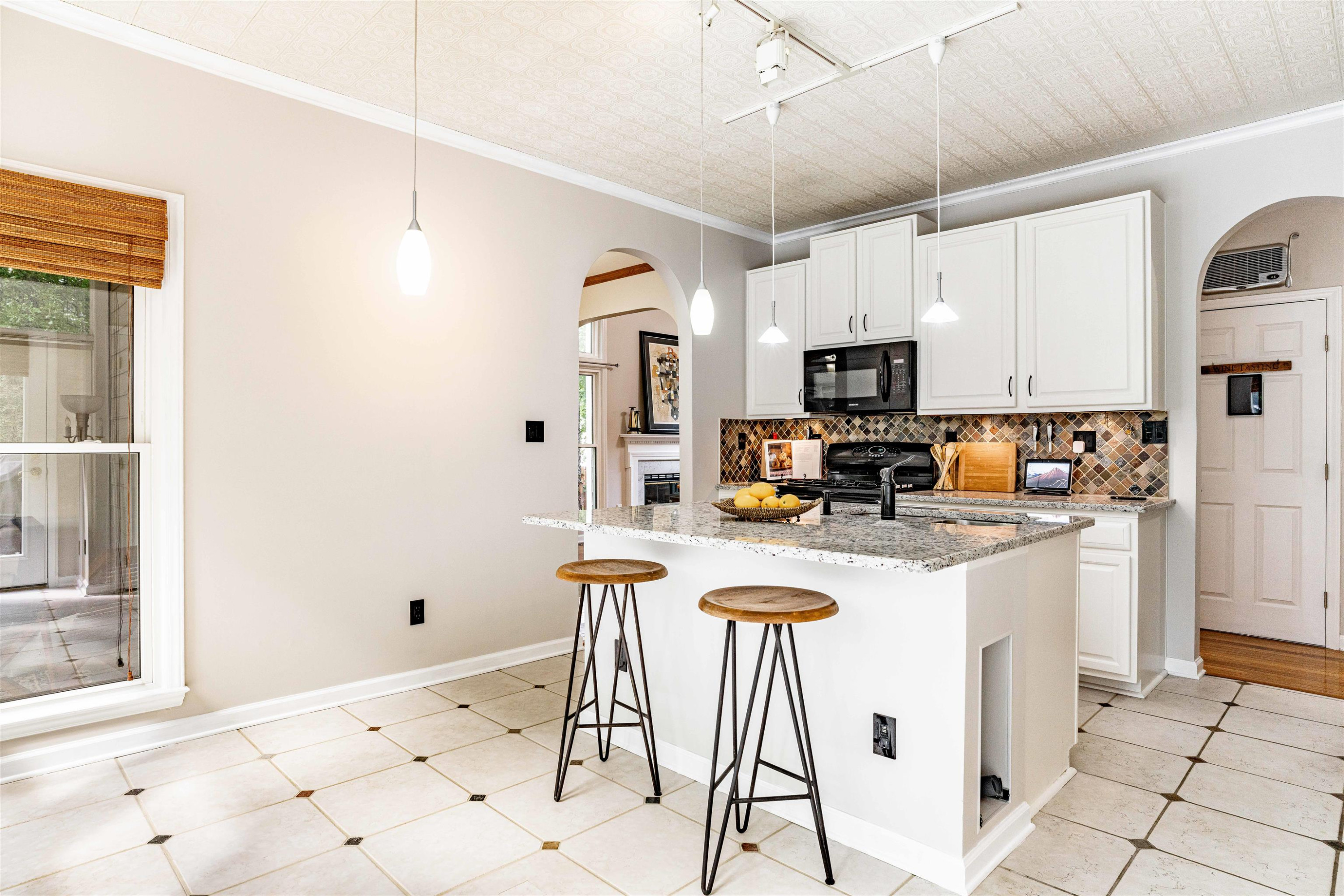 407 Catlin Road Cary, NC 27519 - Photo 8 of 42 a kitchen with granite countertop a refrigerator a stove a sink dishwasher and white cabinets with wooden floor