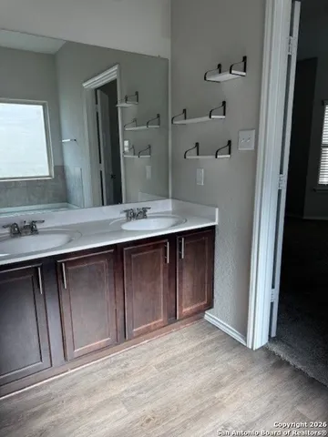 a view of cabinets with wooden floor