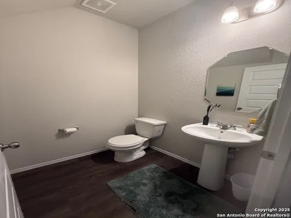 a bathroom with a sink and a toilet