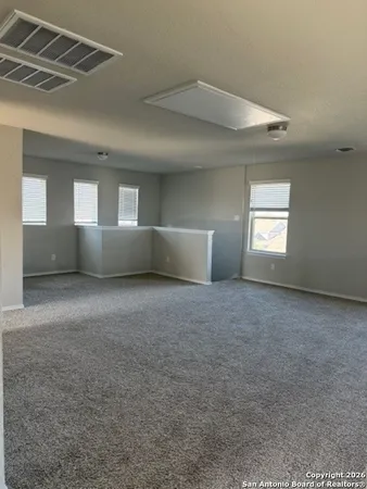 a view of empty room with windows