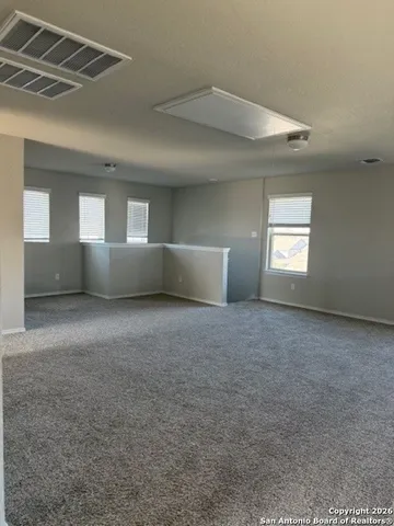 a view of empty room with windows