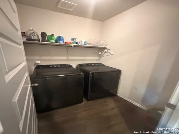 a view of storage and utility room with washer and dryer