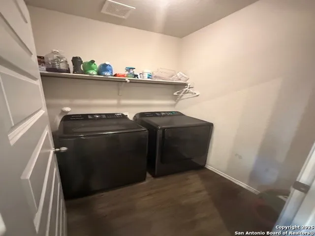 a view of storage and utility room with washer and dryer