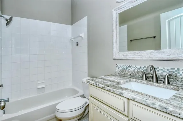 a view of a garden with a building in the background