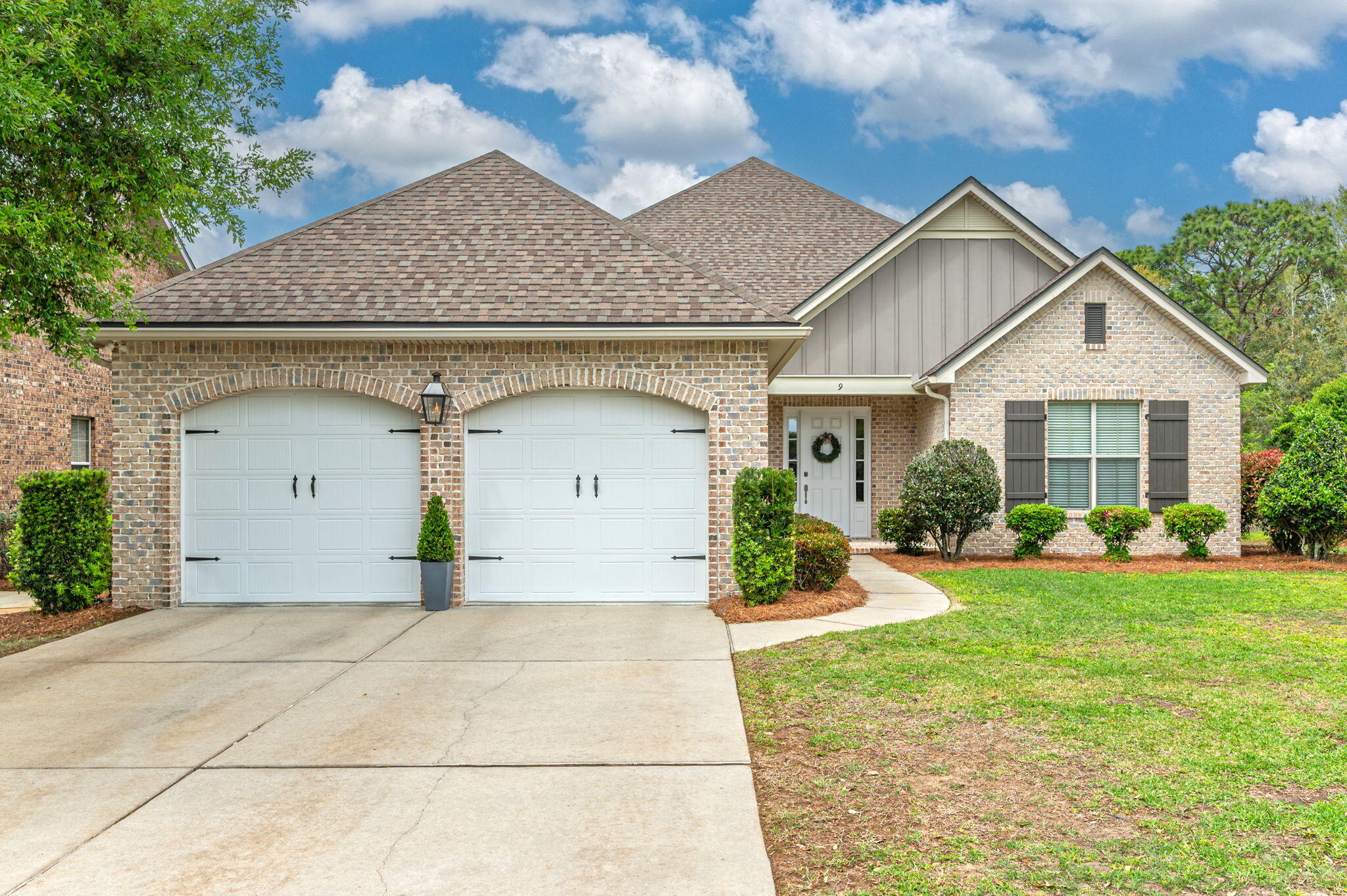 a front view of a house with garden
