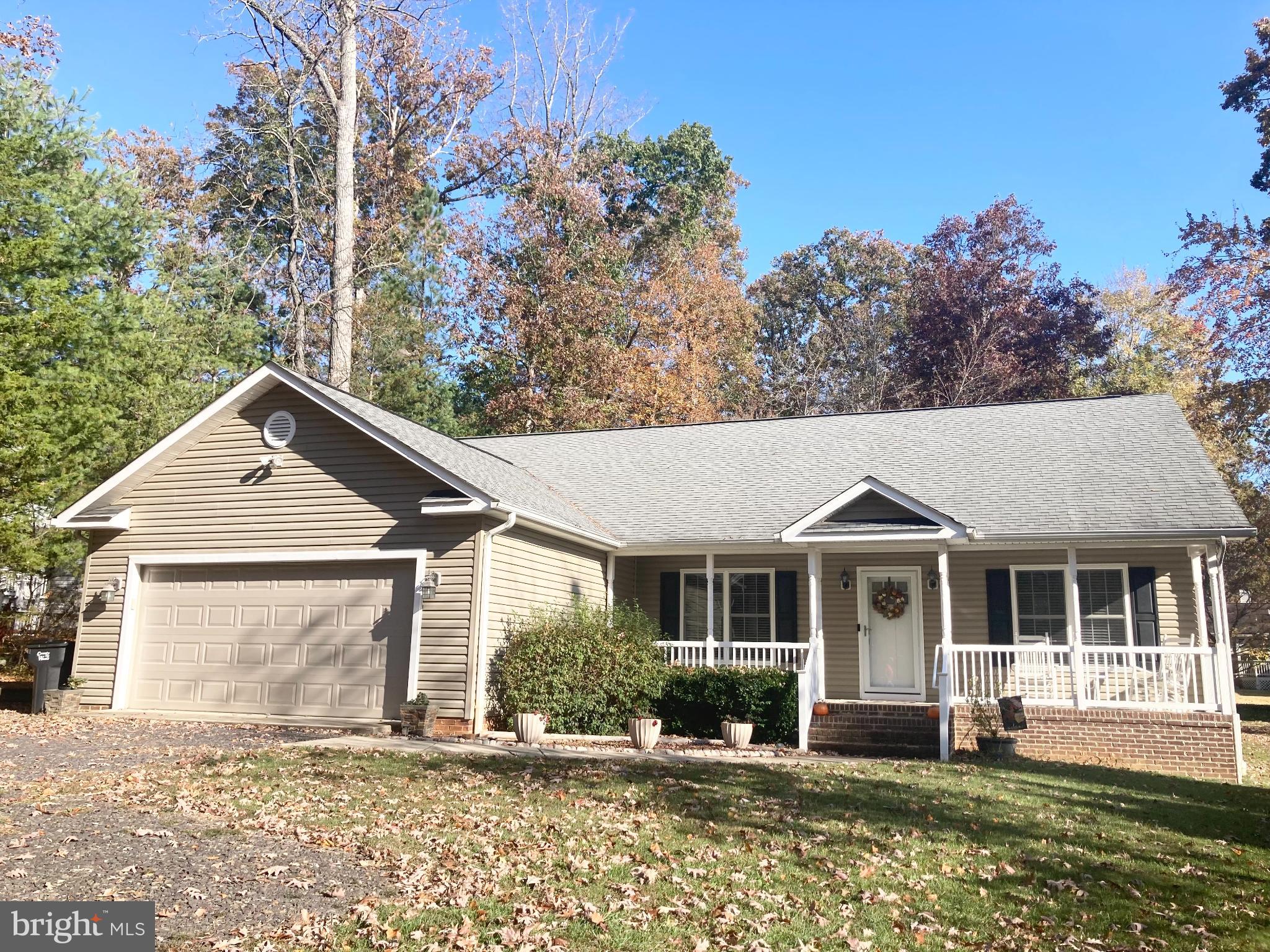 3002 Lakeview Parkway Locust Grove, VA 22508 - Photo 1 of 18 front view of a house with a yard