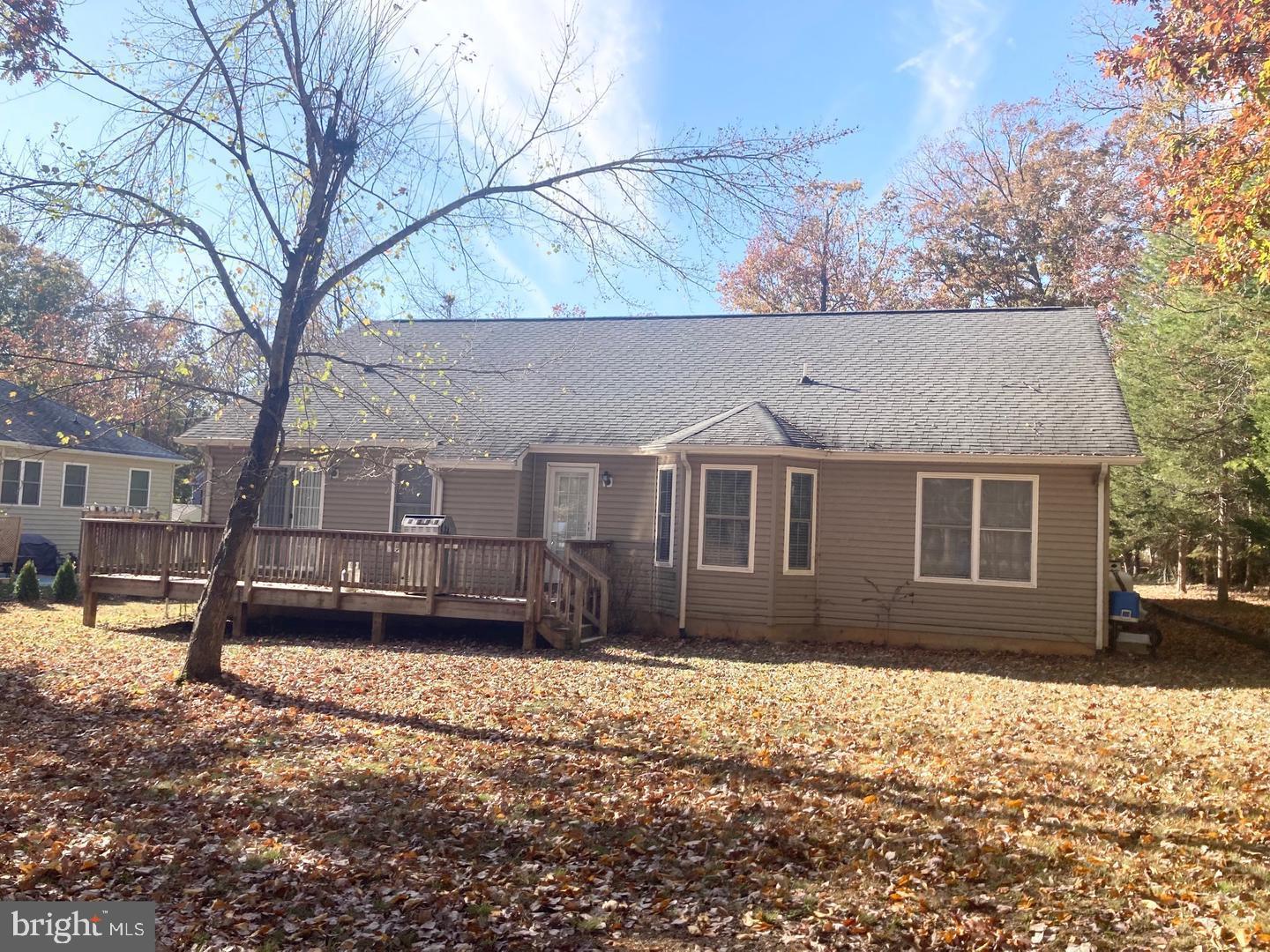 3002 Lakeview Parkway Locust Grove, VA 22508 - Photo 18 of 18 a front view of a house with a yard covered in snow