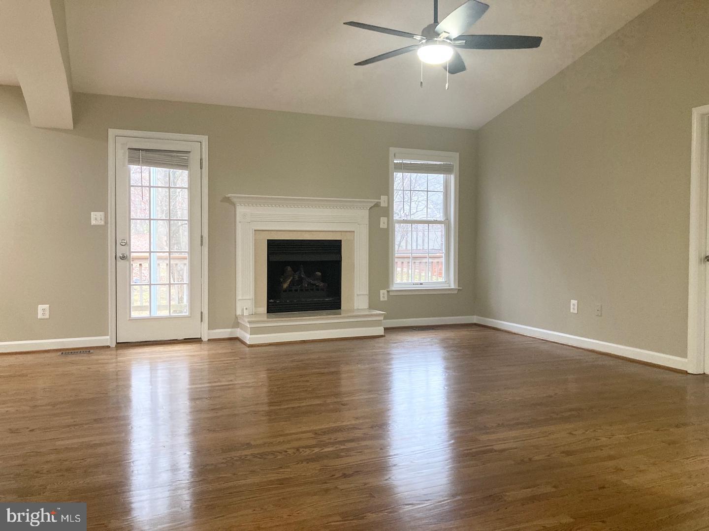 3002 Lakeview Parkway Locust Grove, VA 22508 - Photo 10 of 18 a view of an empty room with wooden floor fireplace and a window