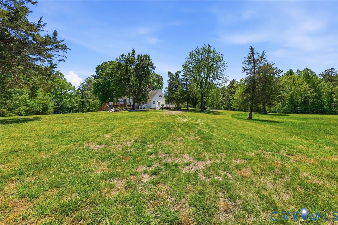 3355 Duke Road Powhatan, VA 23139 - Photo 45 of 67 a view of a grassy field with trees in the background