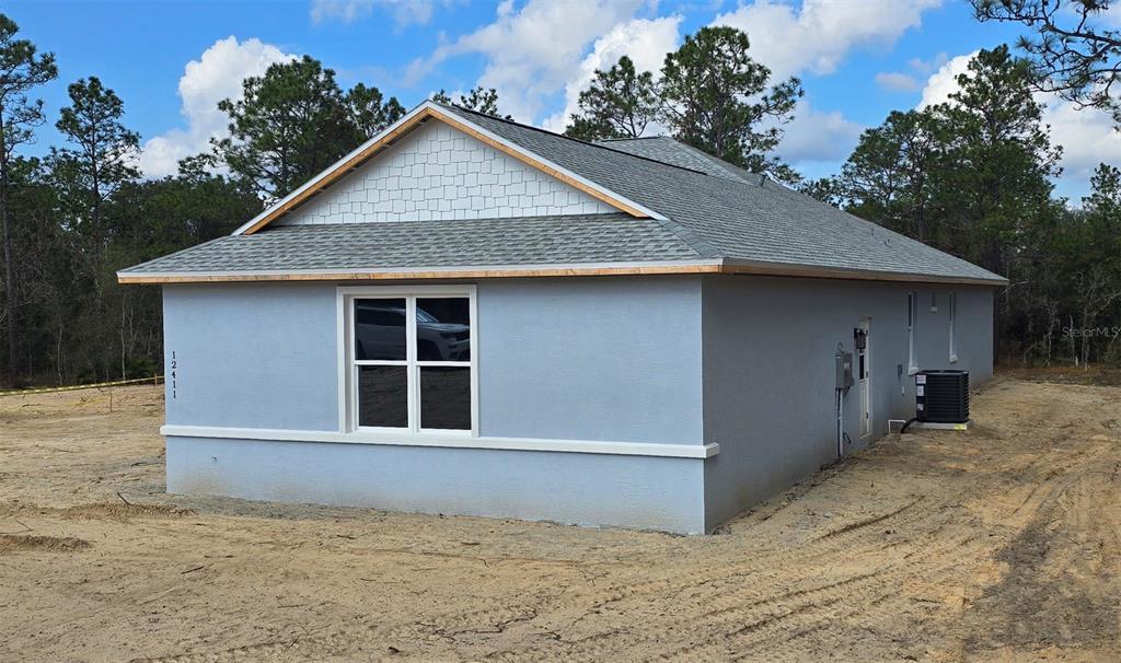 12411 Southwest 71st Lane Road Ocala, FL 34481 - Photo 4 of 50 a house with a outdoor space