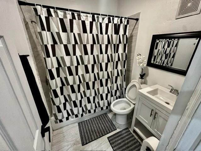 55 Northwest 47th Street Miami, FL 33127 - Photo 14 of 31 a bathroom with a toilet and a mirror
