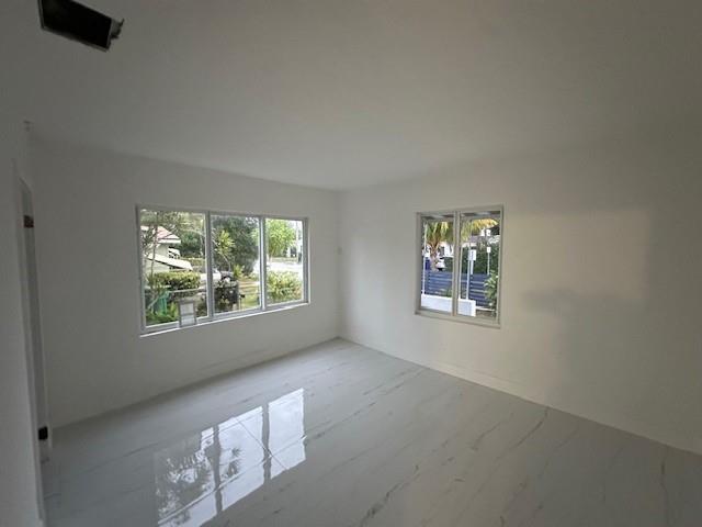 55 Northwest 47th Street Miami, FL 33127 - Photo 17 of 31 a view of an empty room with windows