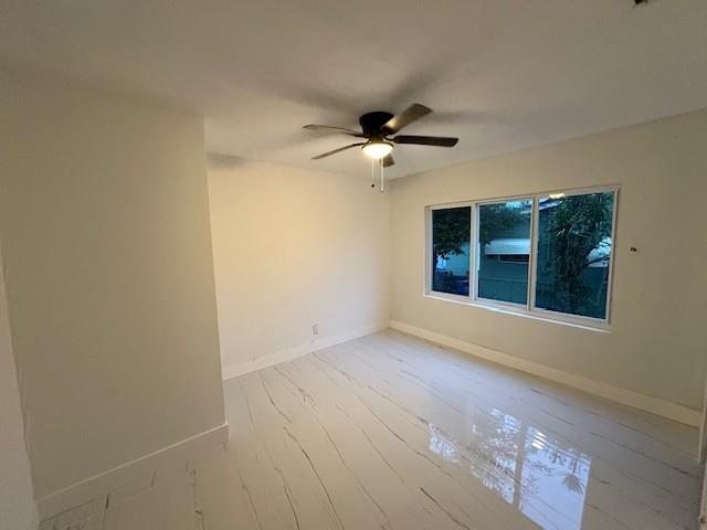 55 Northwest 47th Street Miami, FL 33127 - Photo 18 of 31 a view of an empty room with a window