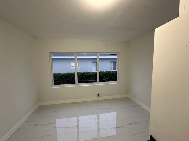 55 Northwest 47th Street Miami, FL 33127 - Photo 19 of 31 a view of an empty room with a window