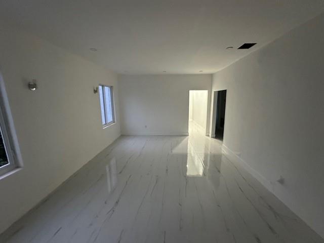 55 Northwest 47th Street Miami, FL 33127 - Photo 21 of 31 a view of an empty room with wooden floor and a window