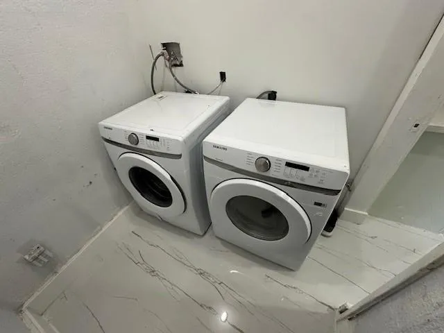 a utility room with dryer and washer