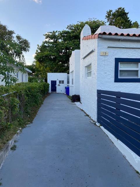 55 Northwest 47th Street Miami, FL 33127 - Photo 3 of 31 a view of a house with a yard and potted plants