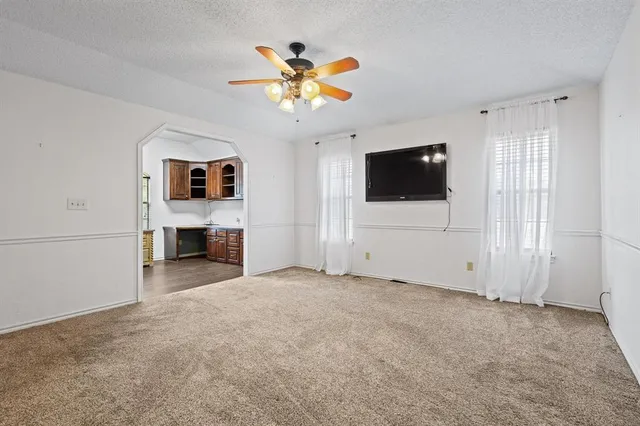 a view of a livingroom with a flat screen tv