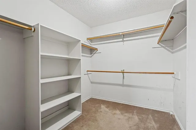 a view of an empty walk in closet