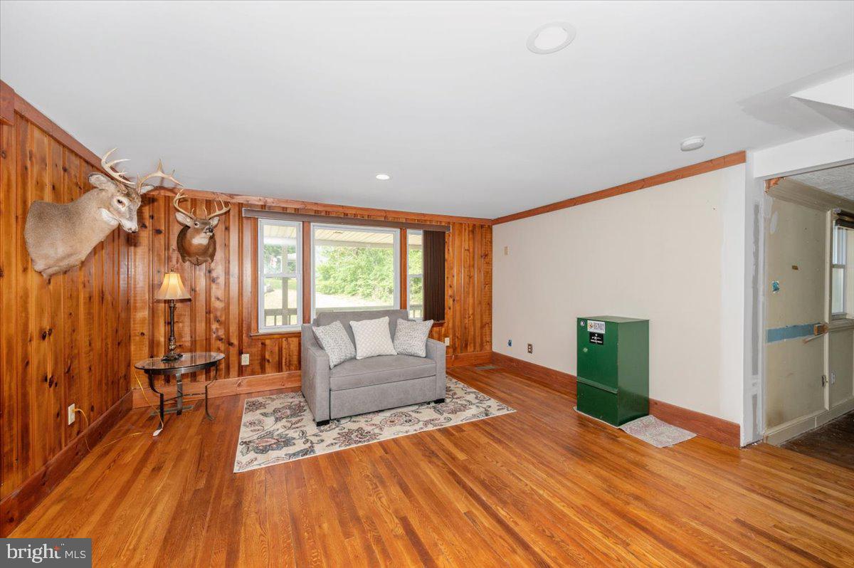 7010 Old Pryor Road Thurmont, MD 21788 - Photo 11 of 62 a living room with furniture and a fireplace