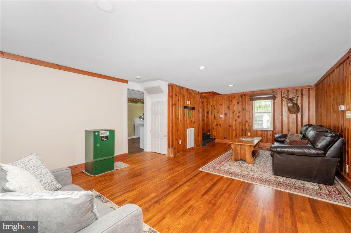 7010 Old Pryor Road Thurmont, MD 21788 - Photo 12 of 62 a living room with furniture and large windows