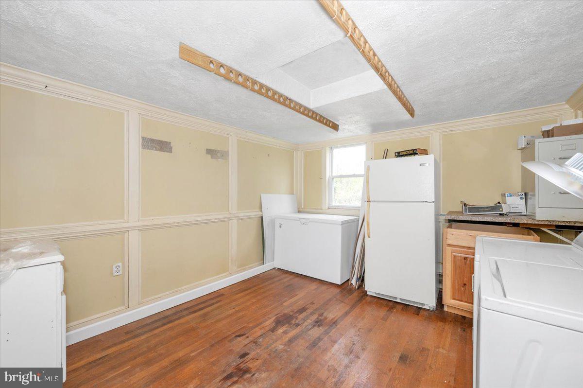 7010 Old Pryor Road Thurmont, MD 21788 - Photo 21 of 62 a view of a kitchen with refrigerator and wooden floor