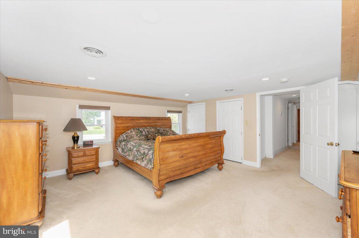 7010 Old Pryor Road Thurmont, MD 21788 - Photo 25 of 62 a bedroom with a bed and a couch