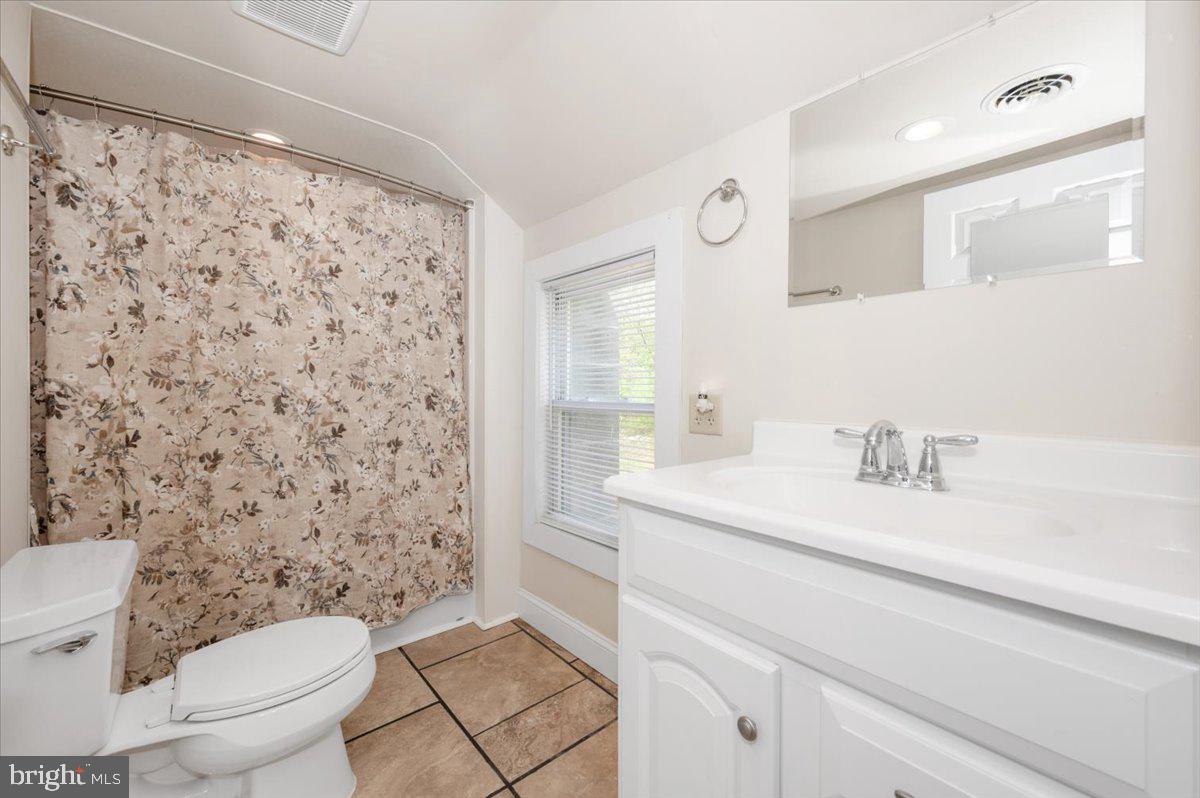 7010 Old Pryor Road Thurmont, MD 21788 - Photo 32 of 62 a bathroom with a sink a toilet and a mirror