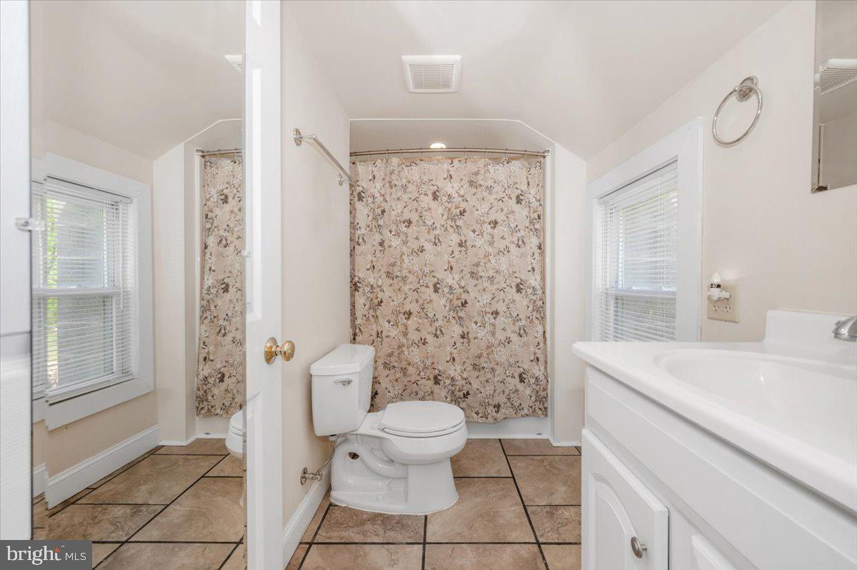 7010 Old Pryor Road Thurmont, MD 21788 - Photo 33 of 62 a bathroom with a sink a toilet and shower