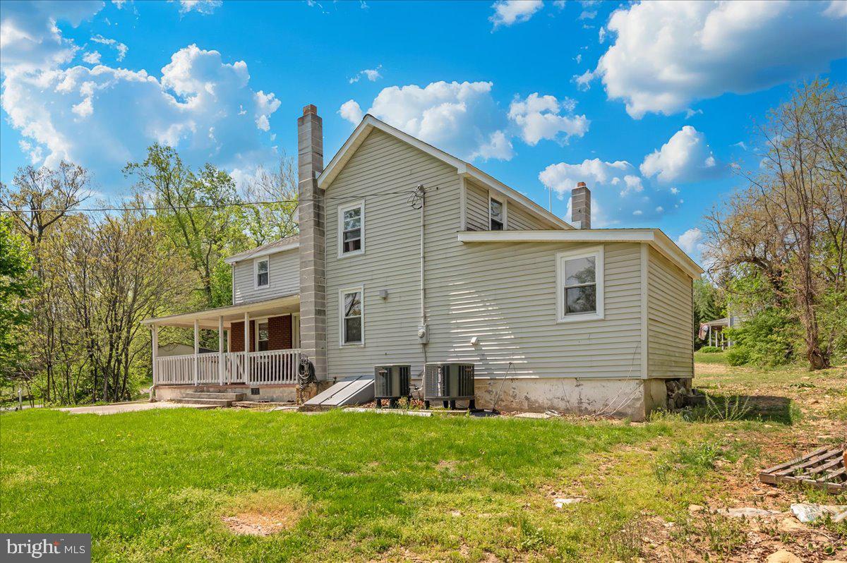 7010 Old Pryor Road Thurmont, MD 21788 - Photo 36 of 62 a backyard of a house with table and chairs
