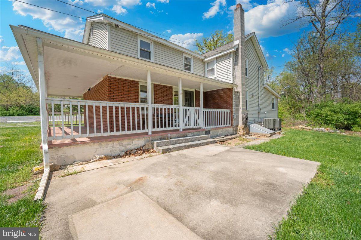 7010 Old Pryor Road Thurmont, MD 21788 - Photo 38 of 62 a backyard of a house with garden and deck
