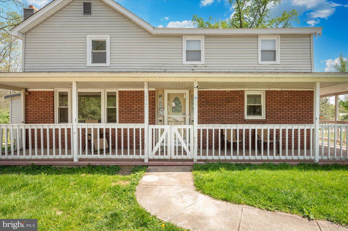 7010 Old Pryor Road Thurmont, MD 21788 - Photo 4 of 62 a view of a house with a small yard and wooden fence