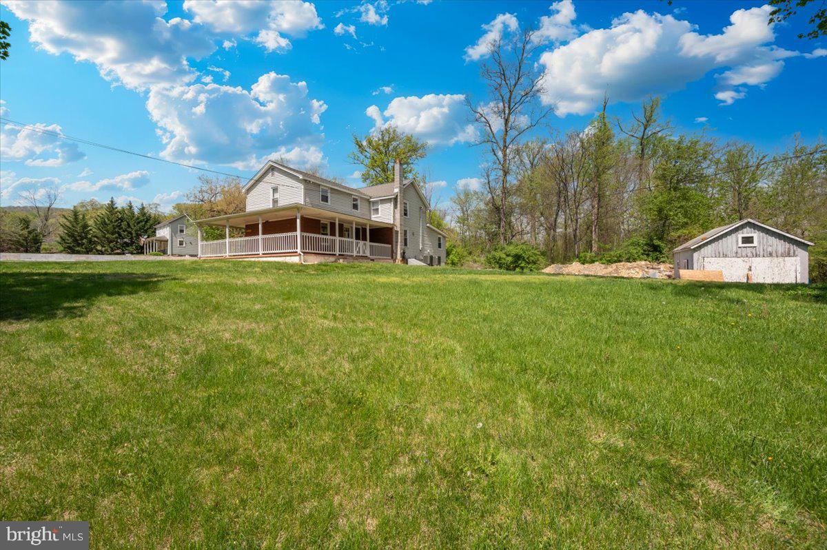 7010 Old Pryor Road Thurmont, MD 21788 - Photo 41 of 62 a view of a big house with a big yard and large trees