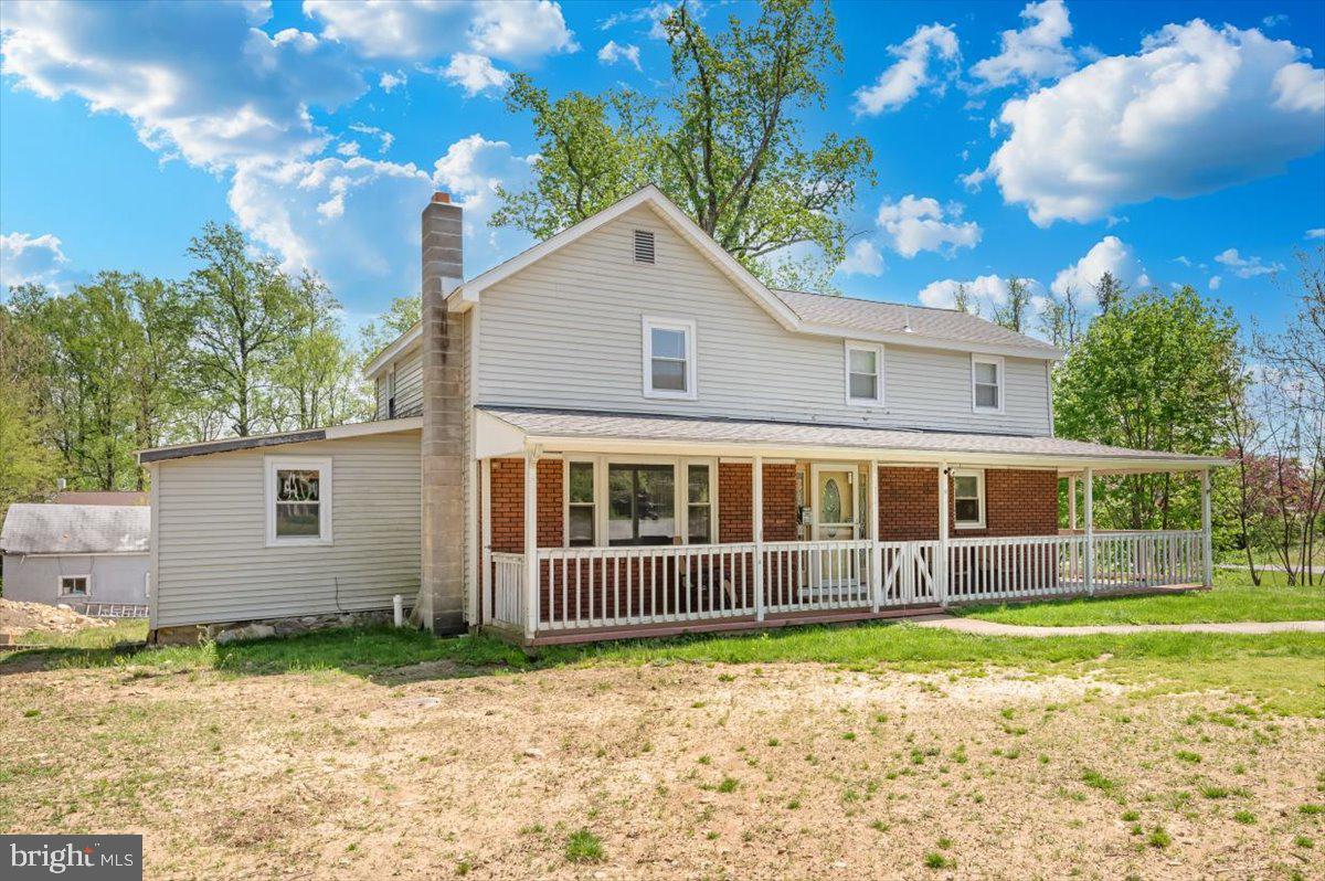 7010 Old Pryor Road Thurmont, MD 21788 - Photo 47 of 62 a front view of a house with a yard