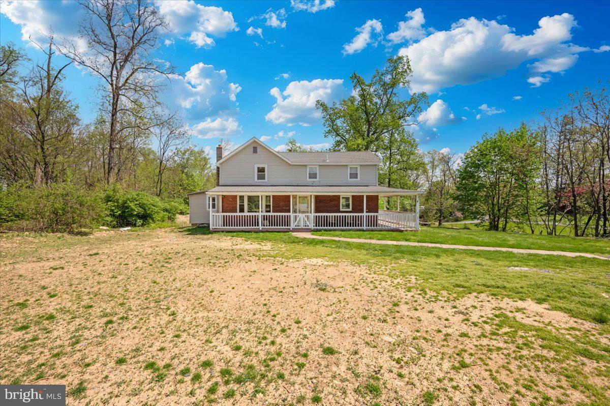 7010 Old Pryor Road Thurmont, MD 21788 - Photo 48 of 62 a front view of a house with a big yard