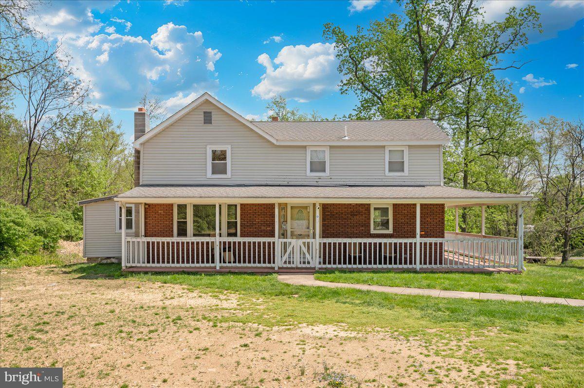 7010 Old Pryor Road Thurmont, MD 21788 - Photo 49 of 62 a front view of a house with a garden