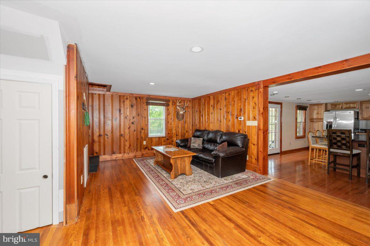 7010 Old Pryor Road Thurmont, MD 21788 - Photo 7 of 62 a living room with furniture and a wooden floor