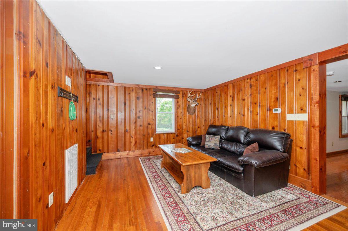 7010 Old Pryor Road Thurmont, MD 21788 - Photo 8 of 62 a living room with furniture and a rug