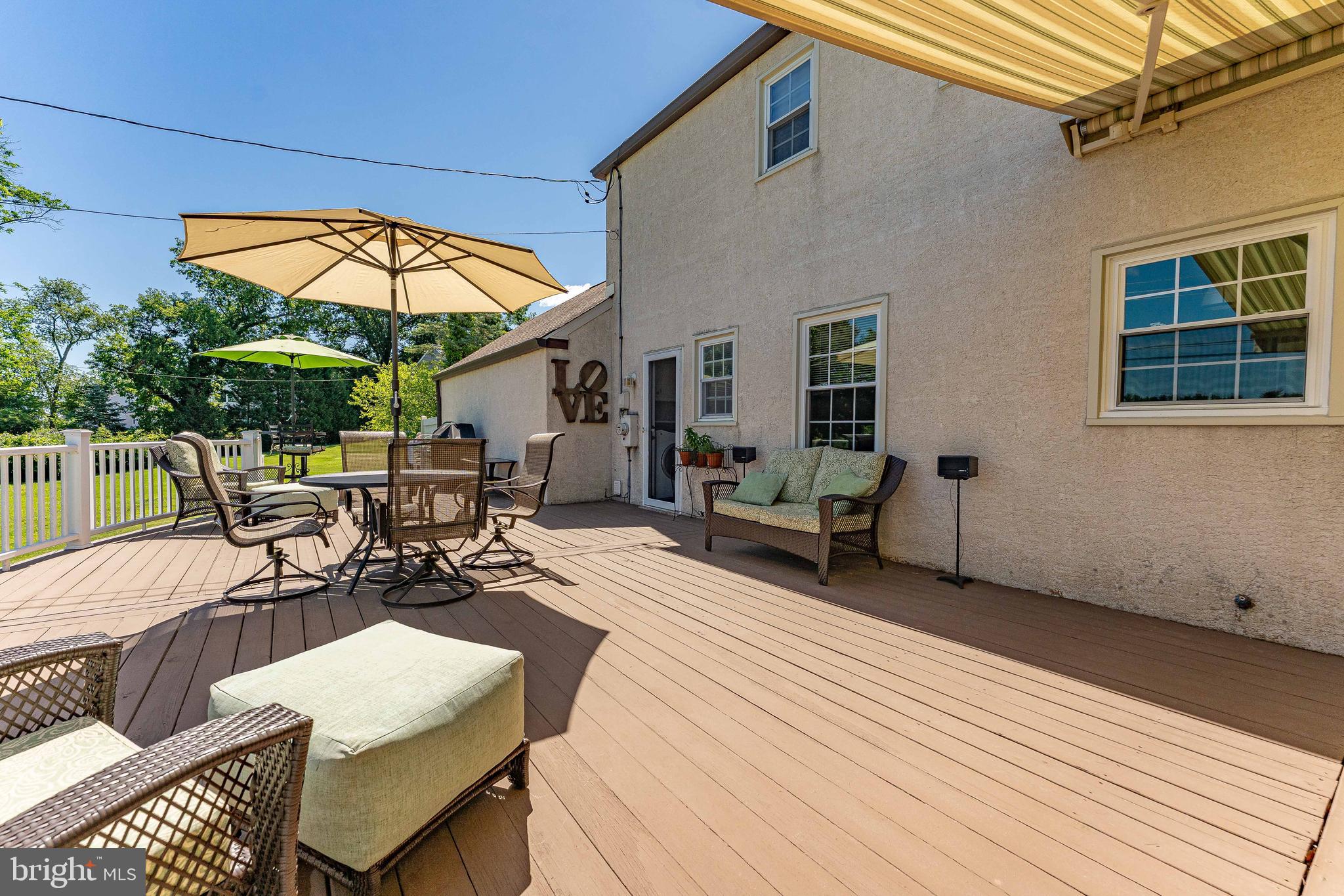 84 North Spring Lane Phoenixville, PA 19460 - Photo 47 of 51 a view of a patio with table and chairs with wooden floor and fence