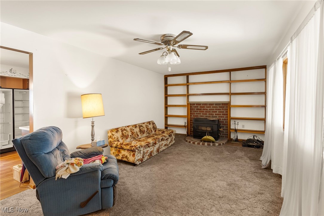 3907 Edwards Street Mineral Ridge, OH 44440 - Photo 25 of 45 Living area with a ceiling fan and carpet flooring