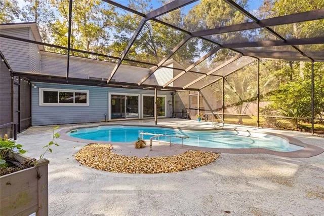 a view of a house with swimming pool