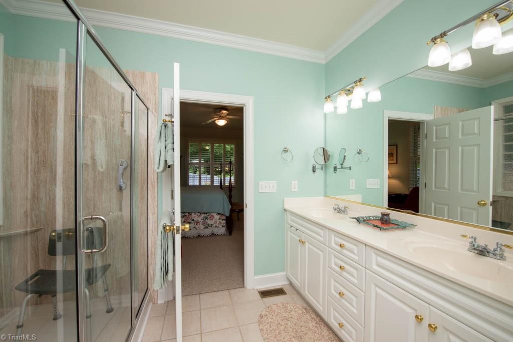 3859 Waterview Road High Point, NC 27265 - Photo 20 of 38 Primary bathroom with walk in shower. Leads to walk in closet.