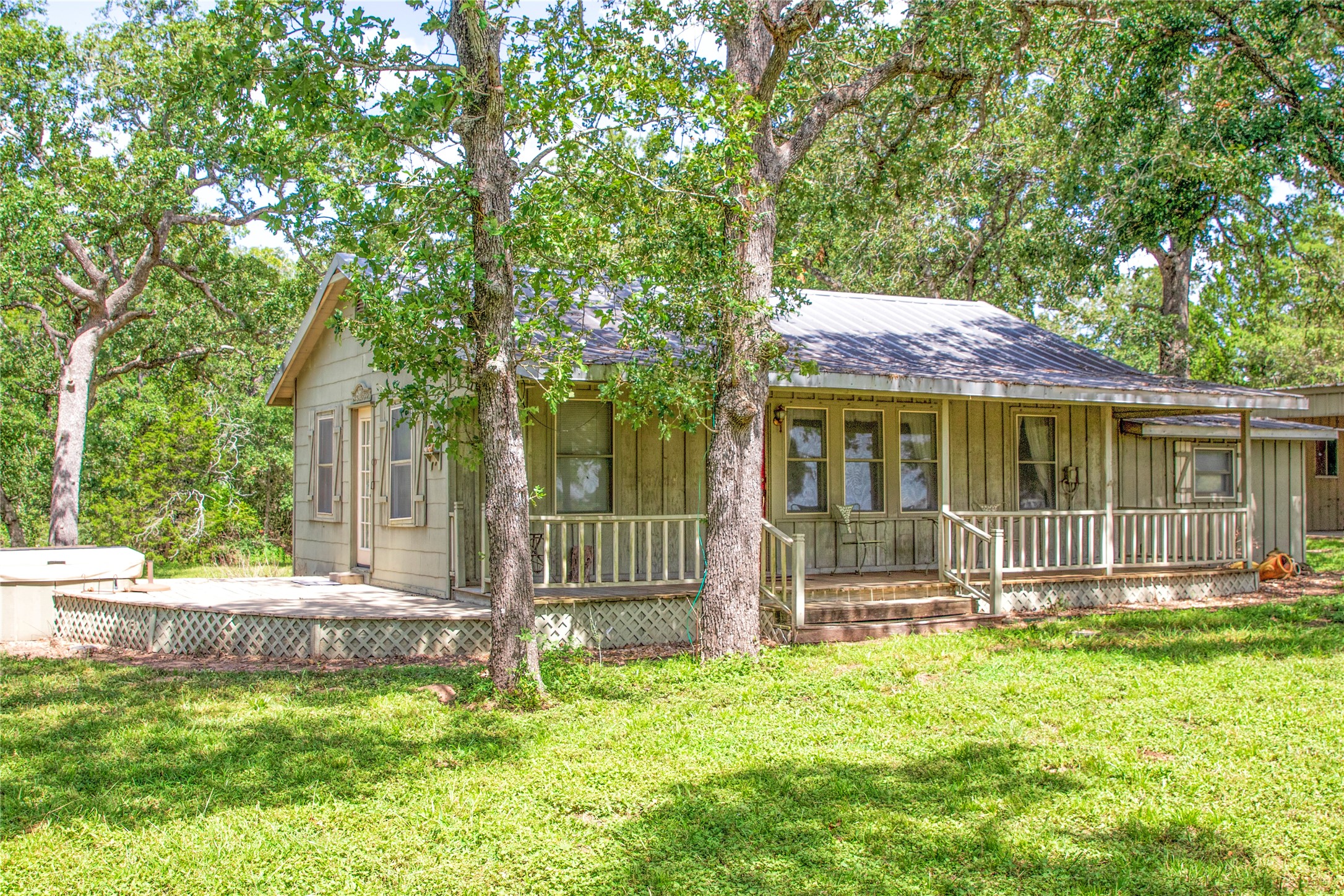 6750 Three Mile Road Flatonia, TX 78941 - Photo 12 of 35 a front view of a house with a yard table and chairs
