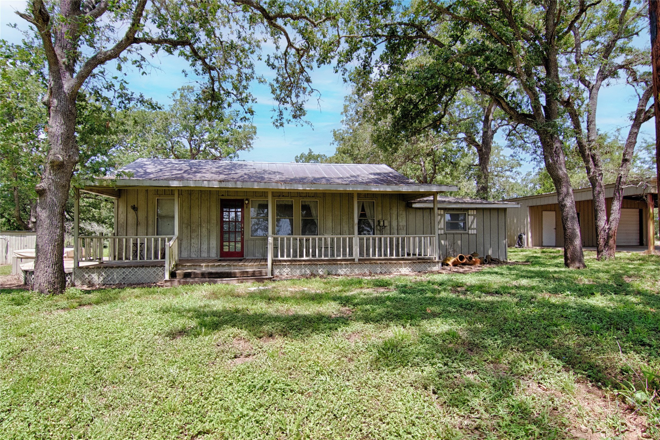 6750 Three Mile Road Flatonia, TX 78941 - Photo 13 of 35 a front view of a house with a garden