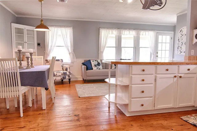 a living room with furniture window and wooden floor