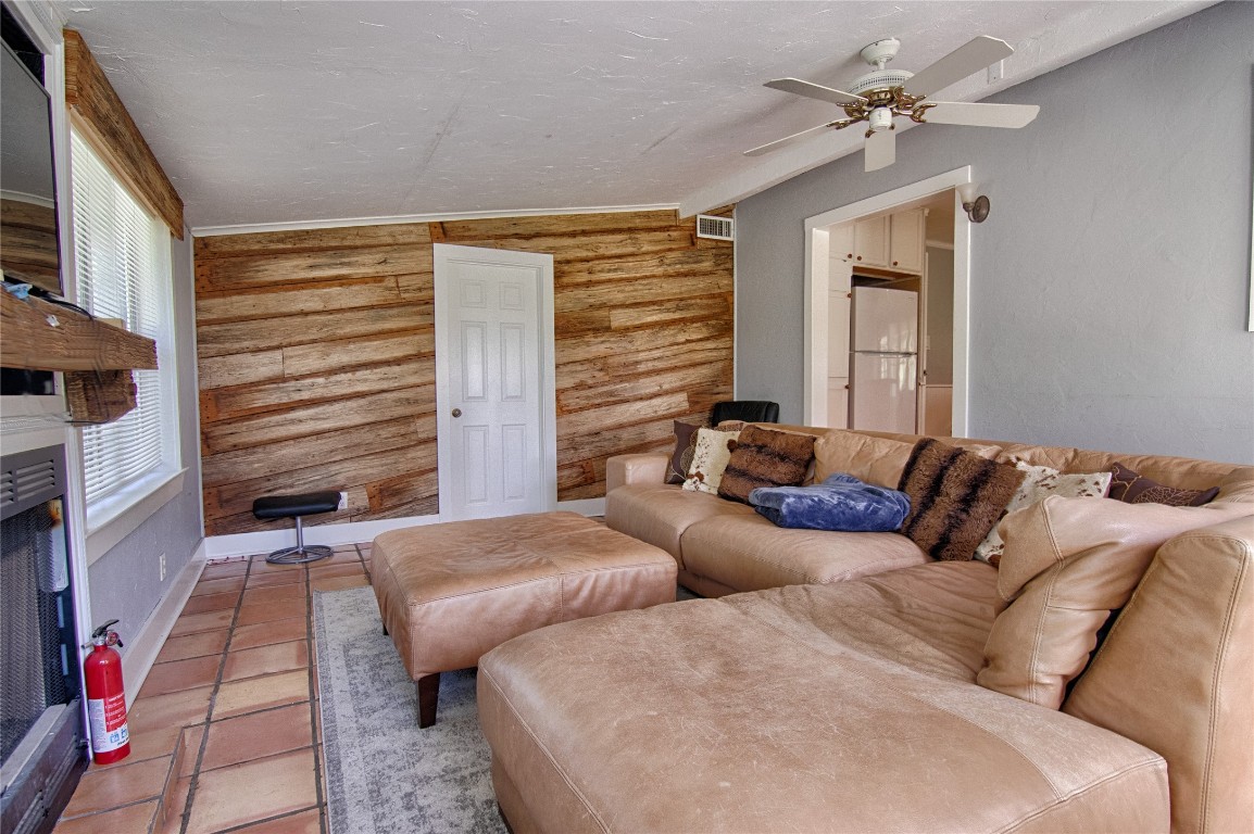 6750 Three Mile Road Flatonia, TX 78941 - Photo 20 of 35 a living room with furniture and a fireplace