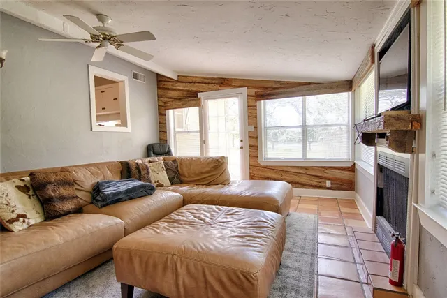 a living room with a couch and a fireplace