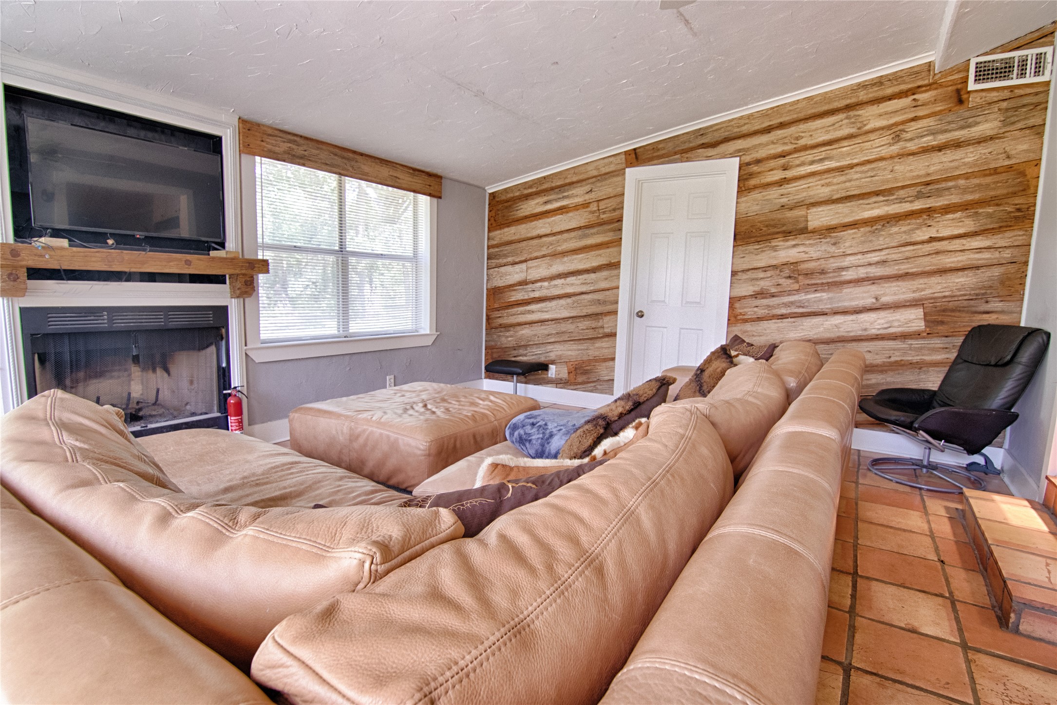 6750 Three Mile Road Flatonia, TX 78941 - Photo 23 of 35 a bedroom with a bed and a flat screen tv