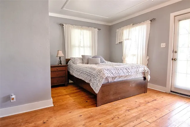 a bedroom with a bed and window