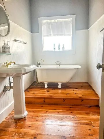 a bathroom with a toilet and a shower curtain